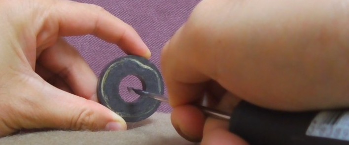 place the magnet on the screwdriver shaft
